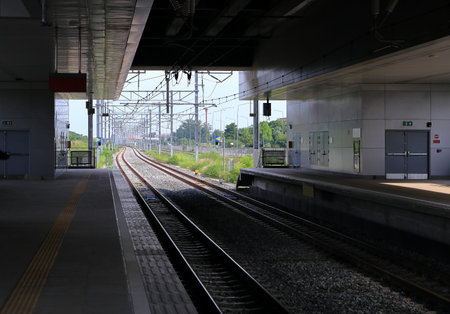 empty new railway station platform during covid-19 situation with perspective view.