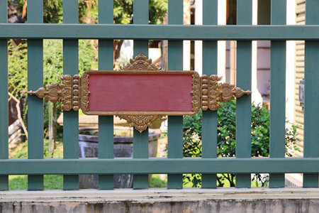 Empty wooden billboard in garden. Signboard made of wood with space for text and graphics