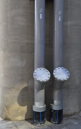 Drainage pipes, pipe with label RL with direction for rain line to drain the water from building.