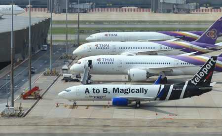 Suvarnabhumi International Airport. Airplane parking at satellite parking bay. Service passengers by...