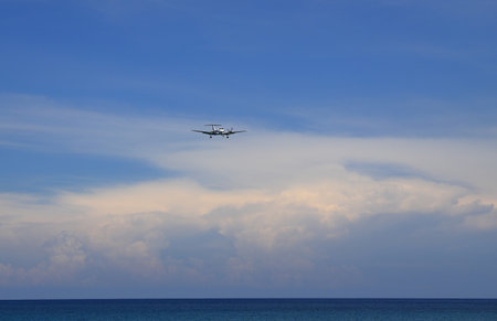 Airliner or Passenger plane Beechcraft B350i King Air landing to airport next to the beach. airplane flies extremely low over the sea beach.のeditorial素材