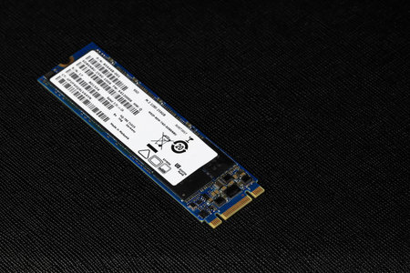 Solid state drives for computer - ssd sata, NVME PCIe, SATA SSD m key, b key isolated on dark backgroundのeditorial素材