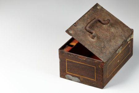 Open Vintage small metal money box or steel chest isolated on white background.の写真素材