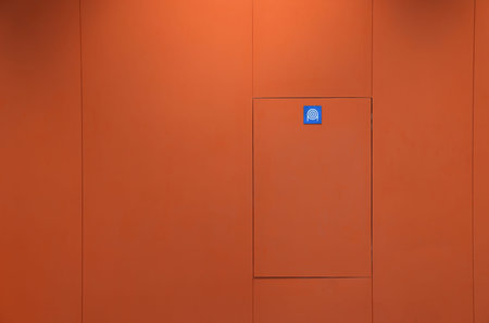 Fire hose cabinet, Fire equipment box, walkway area in modern building, minimal design.の写真素材