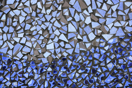 Colorful pattern ceramic tiles or mosaic. Detail of beautiful old collapsing abstract ceramic mosaic adorned building. Venetian mosaic as decorative background.の写真素材