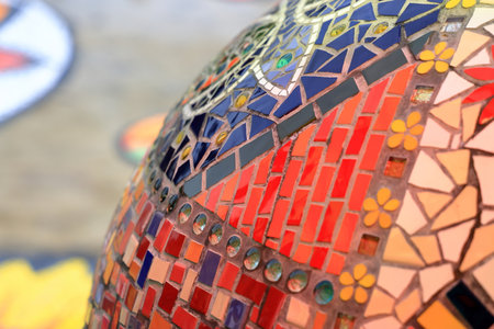 Colorful pattern ceramic tiles or mosaic. Detail of beautiful old collapsing abstract ceramic mosaic adorned building. Venetian mosaic as decorative background. Selective focus.の写真素材