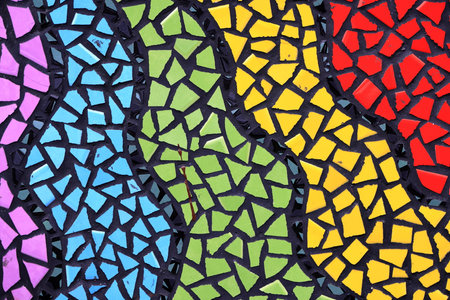 Colorful pattern ceramic tiles or mosaic. Detail of beautiful old collapsing abstract ceramic mosaic adorned building. Venetian mosaic as decorative background. Selective focus.の写真素材