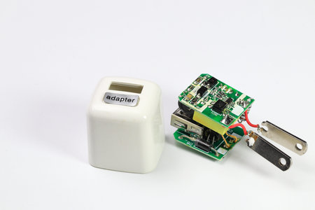 inside of usb charger adapter on white background, broken Charger gadgets isolated on a white...