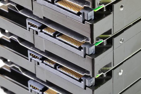 pile or stack of HDD, SSHD Hybrid hard disk drives 3.5" standard profile show on SATA interface, isolated on white backgroundの写真素材