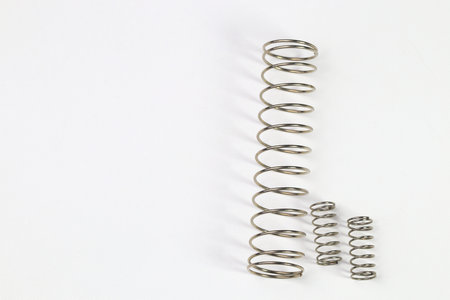 Various metal springs for different purposes, many small chrome springs, Metal spring isolated on...