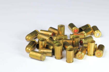 Vareity of used ammunition shells isolated on white backgroundの写真素材