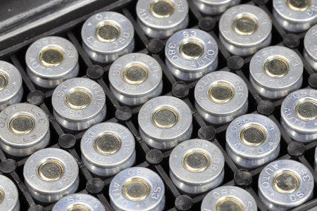 .380 auto S3 Ammunition shells in a plastic box backgroundの写真素材