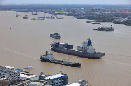 Logistics and shipping transportation on river,  Oil gas tanker and goods ships vessel on river to the ocean. international import export cargo vessel to ocean.のeditorial素材