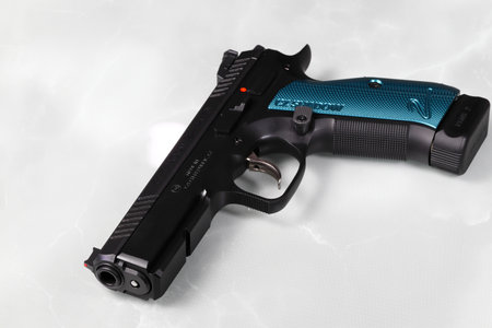A CZ shadow 2 9 mm Luger sports pistol with a red dot sight, Automatic steel pistol made by Czech firearm manufacturer ÄZUB.のeditorial素材