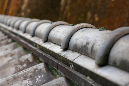 The traditional Japanese ridge tiles covering the ancient Japanese home.の写真素材