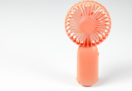 Small plastic Portable fan front view, isolated on white background.の写真素材