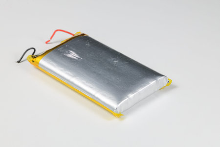 damaged swollen Lithium polymer, Li-ion batteries for mobile device isolated on white background.