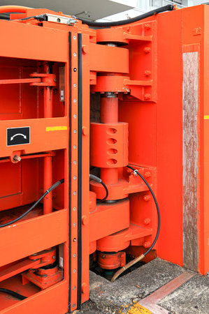 Hydraulic Hinge of big red gate at port, steel gate for Water retention and port traffic.