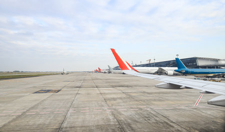 view from airplane window, panorama view of busy international airport.の写真素材