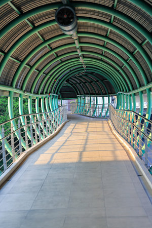 Pedestrian pathway or corridor or hallway between train station and other building.