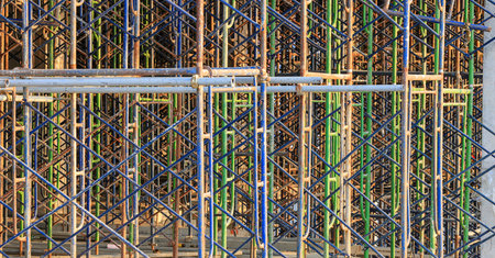A large number of scaffoldings are used in large construction projects. Scaffolding for on...