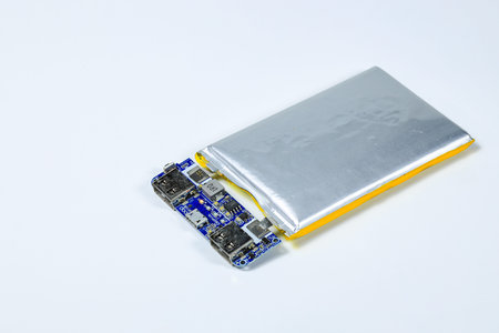 damaged swollen Lithium polymer, Li-ion batteries for mobile device isolated on white background.
