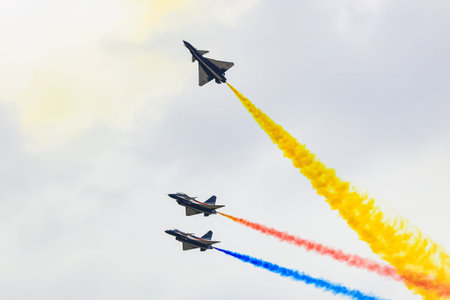J-10 of China Air Force Aerobatics team on formations with colorful smokes venting from the plane.