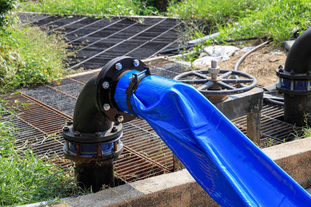 Dewatering pump with connected pipes and hoses of flood management system.