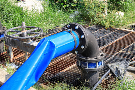 Dewatering pump with connected pipes and hoses of flood management system.