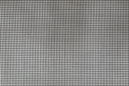 Steel mesh, metal net or wire screen texture, black grid pattern on the window.