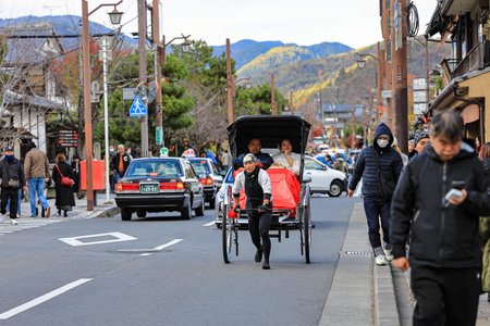 Jinrikisha or Japanese rickshaw driven on service with tourists.のeditorial素材