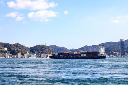 A large ocean liner departed, toward the sea at Kitakyushu, Japan.