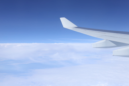 The airplane is on the blue sky.の写真素材