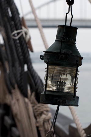 Old oil lamp on sailing ship. Vintage.の写真素材