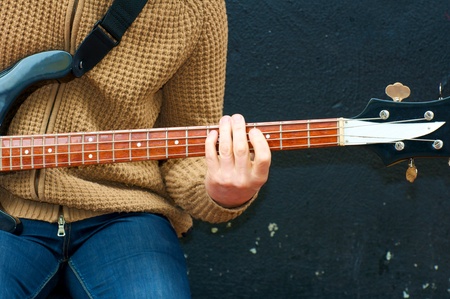 Man playing bass guitar during on street during Mardi Gras Festival の写真素材