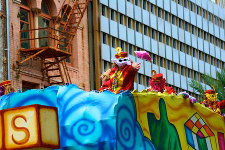 Mardi Gras parade throwing beads to crowd 