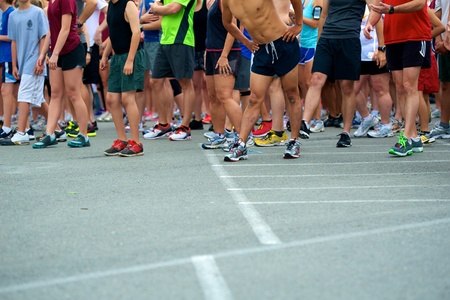 Joggers at starting line just prior to starting gun.のeditorial素材