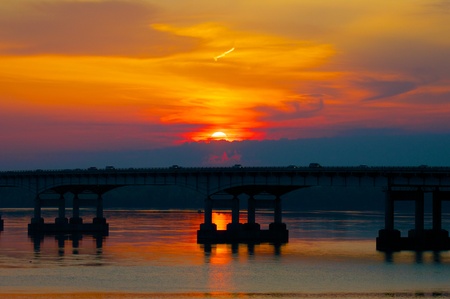 Sunrise over a river bridge  A city waking up の写真素材