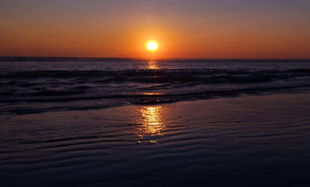 Nice view of the Sunset in sea beachの写真素材