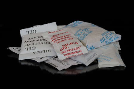 Different kinds of sachets of silica gel used used to attract moisture in packagingの写真素材