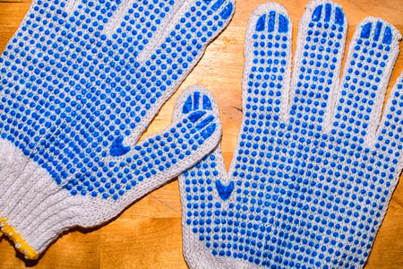 A pair of work gloves on the working surface