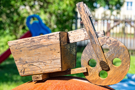 A Age deco wooden scooters in the gardenの写真素材