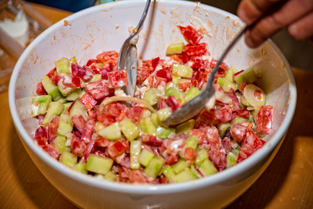 freshly prepared mixed salad in the salad bowlの写真素材