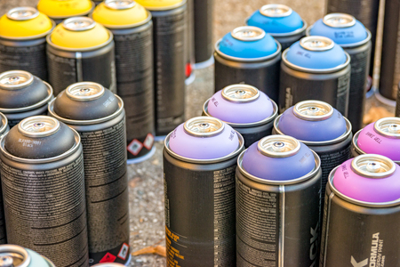 Many different spray cans with different colorsの写真素材