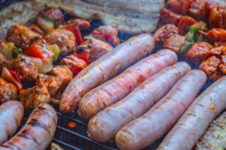 Bratwurst with shashlik and bacon on the grill