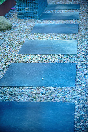 Large paving slabs lie on the ground