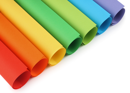 Rolls of colored construction paper isolated with shadows on white background.の写真素材