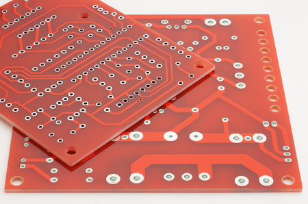 New printed circuit boards without electronic components on a white background.の写真素材