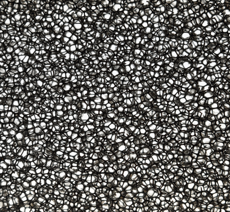 Black open cell  foam rubber macro. Thin sheet.の写真素材