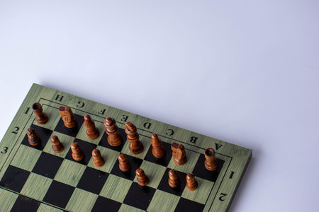 Chess pieces on a chessboard isolated on a white background.